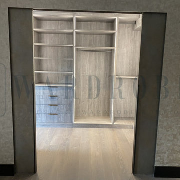 Bespoke walk-in wardrobe with sliding entrance doors