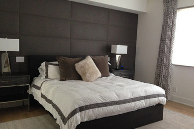 Trendy master light wood floor bedroom photo in Denver with gray walls