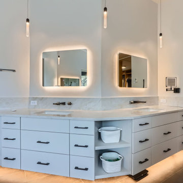 Modern Spa-Inspired Primary Bathroom with Custom Lighting and Views