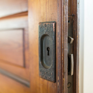 Plantation door separating the kitchen from the mudroom
