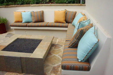 Large contemporary backyard patio in Austin with a fire feature, natural stone pavers and no cover.