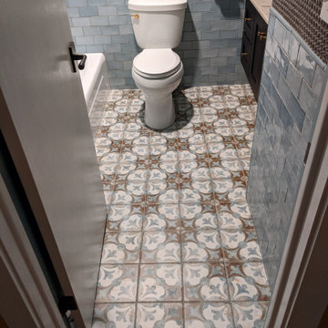 Subway Tiled Bathroom w/ Deco Floor Tile and Penny Round Accent