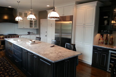 Large trendy u-shaped dark wood floor eat-in kitchen photo in Other with raised-panel cabinets, white cabinets, white backsplash, stainless steel appliances, an island, an undermount sink, marble countertops and subway tile backsplash