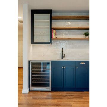Modern Navy Wet Bar with Polished Brass Hardware and Wine Fridge