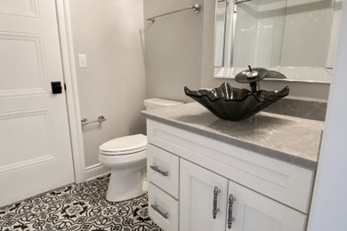 Inspiration for a transitional 3/4 ceramic tile, single-sink and multicolored floor bathroom remodel in Other with gray walls, gray countertops and a built-in vanity