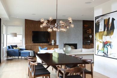 Inspiration for a contemporary light wood floor great room remodel in Vancouver with white walls