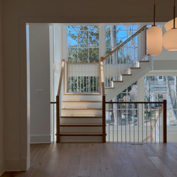 Project #152 | Three-Story White Oak Staircase with a Pendant Chandelier