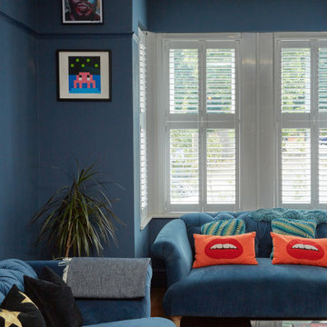 Blue colour drenched maximalist lounge