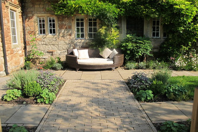 This is an example of a country patio in Other.
