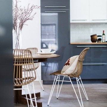 World Market Paperclip Leg Dining Chairs with Red Kilim Pillow