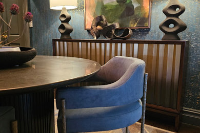 Inspiration for a small 1960s dark wood floor, brown floor and wallpaper enclosed dining room remodel in New York with blue walls
