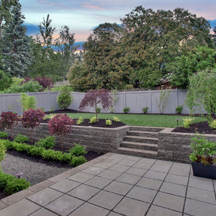 Arts and crafts backyard patio in Seattle with concrete pavers and no cover.
