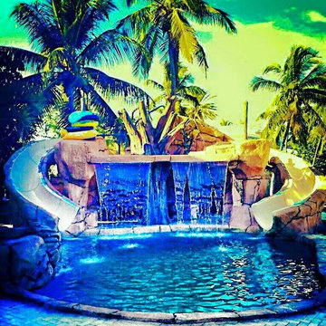 Custom Rock Waterfall with Cave and Rock Spa and Slides