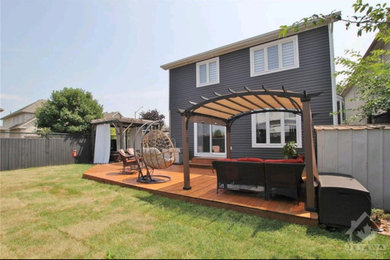 Mid-sized elegant gray two-story vinyl and clapboard exterior home photo in Ottawa with a shingle roof and a black roof