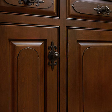 Old World winecellar tasting room cabinetry