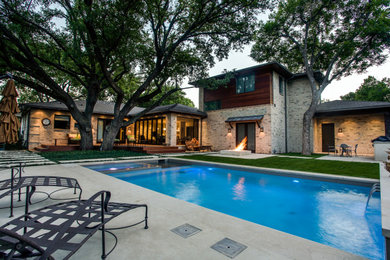 Large trendy multicolored two-story mixed siding house exterior photo in Dallas with a hip roof and a shingle roof