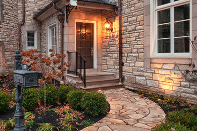 Huge elegant beige three-story stone exterior home photo in St Louis with a clipped gable roof