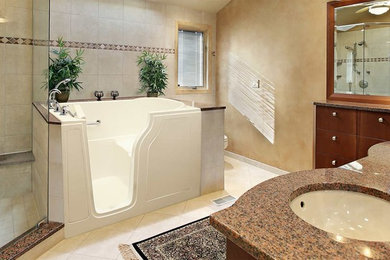 This is an example of a mid-sized traditional master bathroom in Other with flat-panel cabinets, dark wood cabinets, a japanese tub, a corner shower, a one-piece toilet, beige tile, ceramic tile, beige walls, ceramic floors, an undermount sink, quartzite benchtops, beige floor and a hinged shower door.