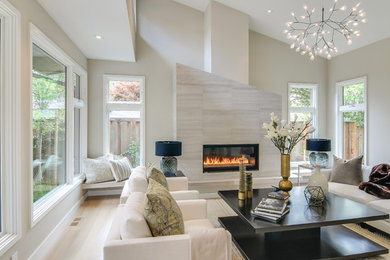 Large trendy formal and enclosed light wood floor and beige floor living room photo in San Francisco with beige walls, a tile fireplace, a ribbon fireplace and no tv
