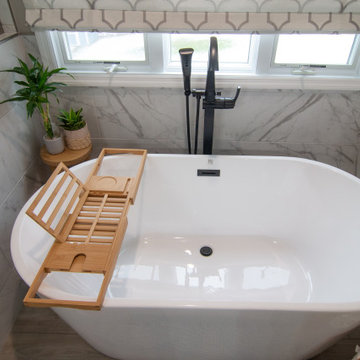 Traditional Master Bathroom With Warm Tones, Stand Alone Tub & Walk In Shower