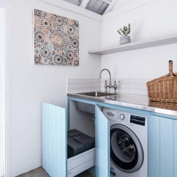 Laundry with stainless steel benchtops