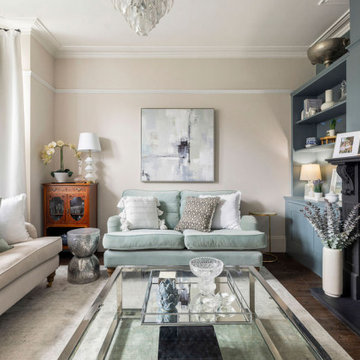 Calm & serene living room with a mix of chrome & brass metal accents