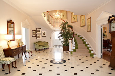 Example of a mid-sized classic ceramic tile and multicolored floor foyer design in Other with white walls