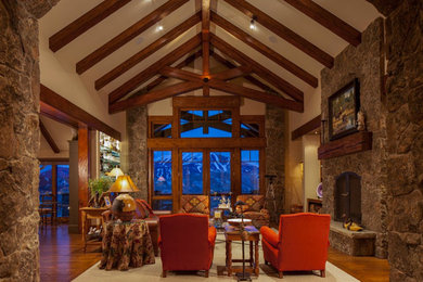 Living room - mid-sized traditional formal and open concept medium tone wood floor living room idea in Other with beige walls, a standard fireplace, a stone fireplace and no tv