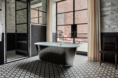 Ornate gray tile and subway tile bathroom photo in Philadelphia with gray walls and a hinged shower door