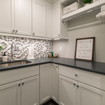 Cozy Laundry Room with Stacked Washer Dryer