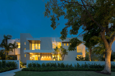 Expansive modern two-storey grey house exterior in Miami.