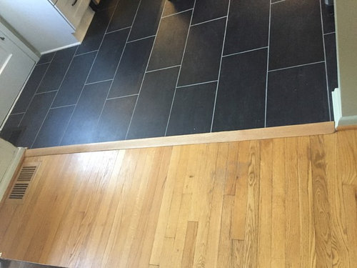Flooring Transition Is Tripping Hazard, How To Make A Transition Between Floor Heights From Tile And Wood