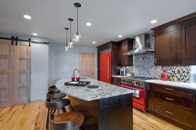 Inspiration for a mid-sized rustic u-shaped light wood floor eat-in kitchen remodel in Seattle with an undermount sink, shaker cabinets, dark wood cabinets, quartz countertops, multicolored backsplash, mosaic tile backsplash, colored appliances, an island and gray countertops