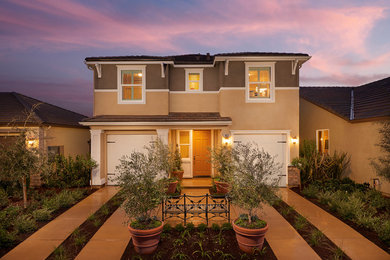 Transitional beige two-story exterior home idea in Other
