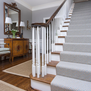 Entry and carpeted stairway