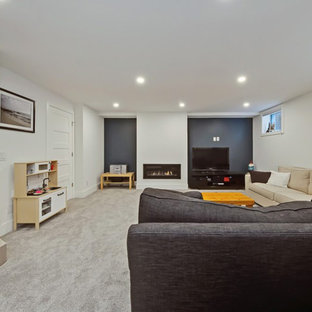 Medium sized contemporary look-out basement in Calgary with white walls, carpet, a plastered fireplace surround, grey floors and a ribbon fireplace.