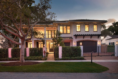 Expansive transitional two-storey brick white house exterior in Miami.