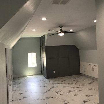 Converted attic space into a 5th bedroom with built-in closets and hidden booksh