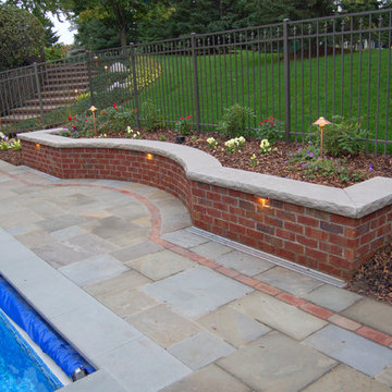 Bluestone pool decks, arbors, fireplaces, outdoor kitchen & pavilion