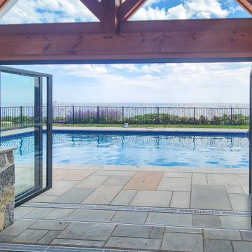 Wide-Open NanaWall Doors Frame the Pool and Ocean Horizon