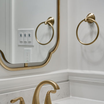 White Bathroom With Golden Finishes