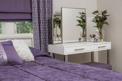 Example of a mid-sized transitional master medium tone wood floor and brown floor bedroom design in Toronto with gray walls and no fireplace