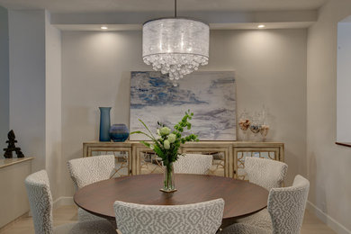 Dining room - mid-sized porcelain tile and beige floor dining room idea in Tampa with beige walls
