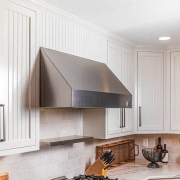 Refurbished kitchen cabinets and customized backsplash with floating shelf