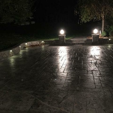 T-Stamped concrete patio, flagstone wall with columns