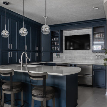 Carmel Basement Wet Bar | Navy Cabinetry & Entertaining Space