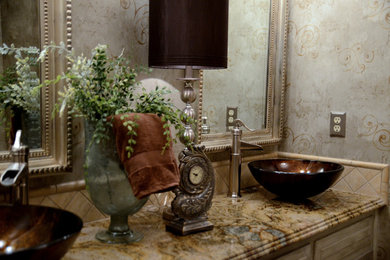 Inspiration for a mid-sized timeless master beige tile and ceramic tile bathroom remodel in Other with beaded inset cabinets, beige cabinets, beige walls, a vessel sink and marble countertops