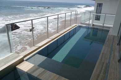 Photo of a contemporary rooftop rectangular pool in Los Angeles with a hot tub.