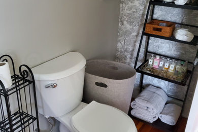 Example of a transitional powder room design in Cleveland