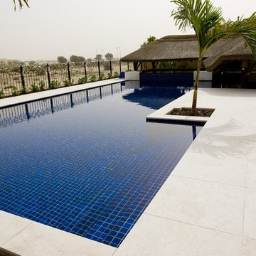 Thatch & timber is the is the focal point of this beautifully landscaped garden